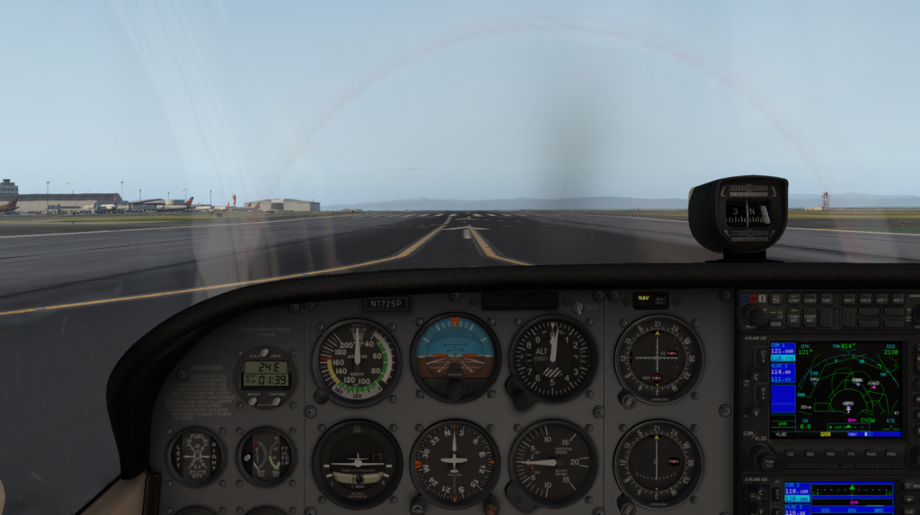 Cessna 172 Skyhawk cockpit view lined up on the runway in X-Plane 11 on a mid-range laptop.